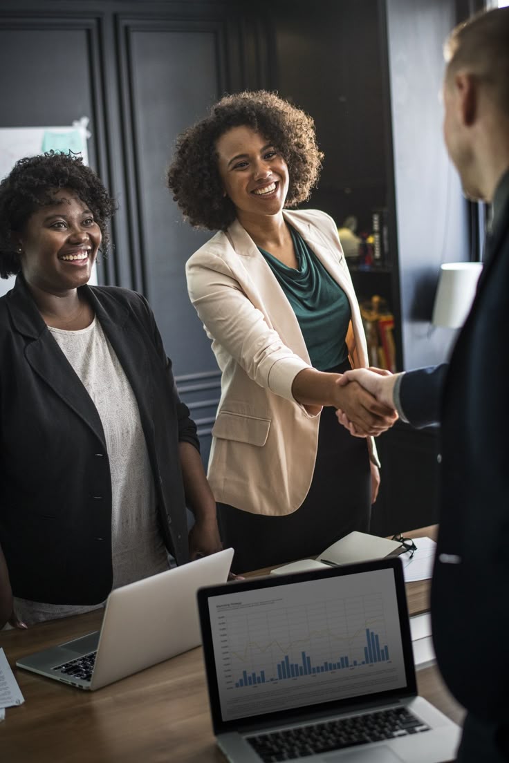 Business team meeting and shaking hands